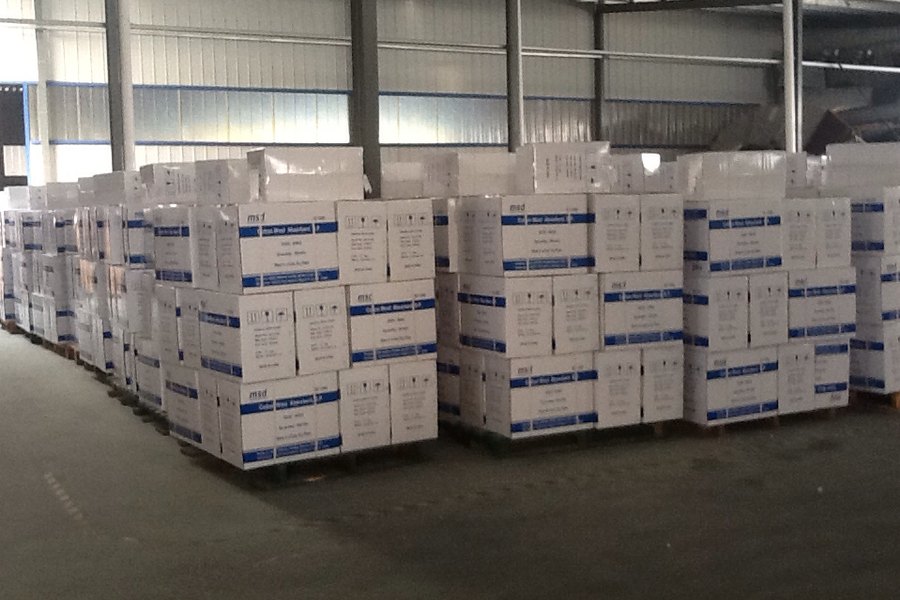 Rows of shrink-wrapped pallets waiting for loading
